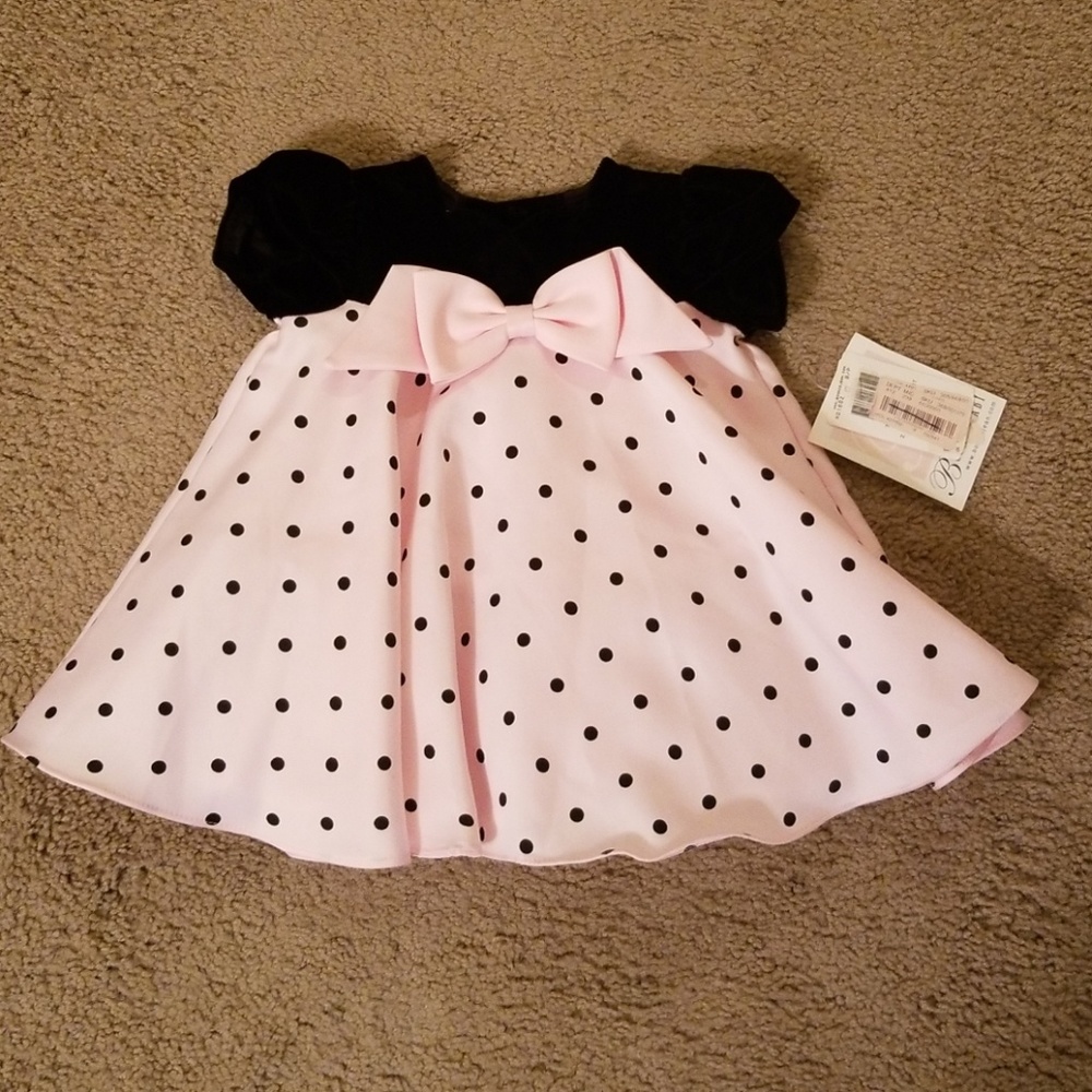 Pink and black polka dot short sleeve dress.